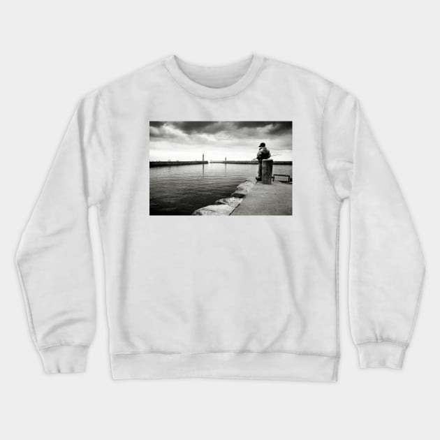 A boy fishing in the harbour at Whitby - Yorkshire, UK Crewneck Sweatshirt by richflintphoto